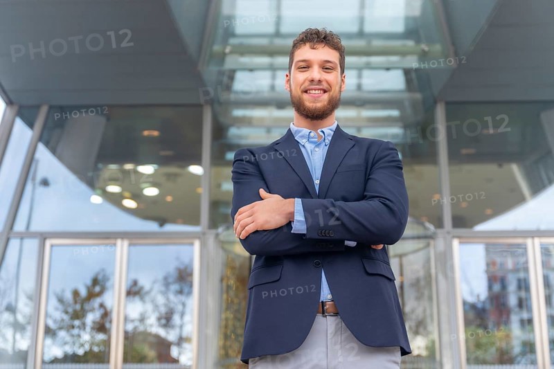 Portrait businessman CEO of a company at glass office entrance