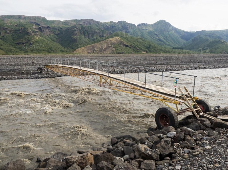Mobile bridge over the glacial river Krossa