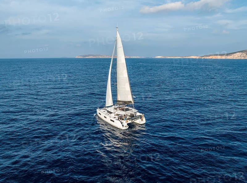 Sailing catamaran in full sail