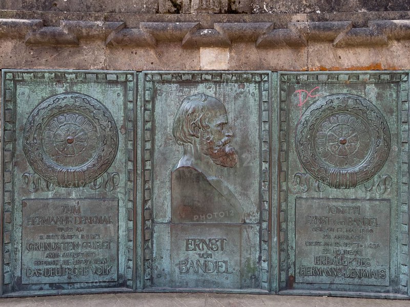 Bronze plaque in honour of the author of the colossal statue Hermann Monument Ernst von Bandel in front of the Hermann Monument