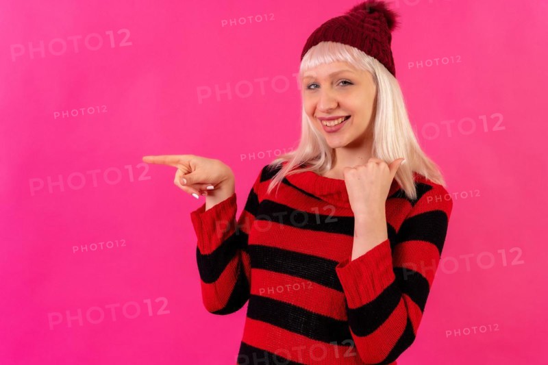 Blonde caucasian girl on pink background studio