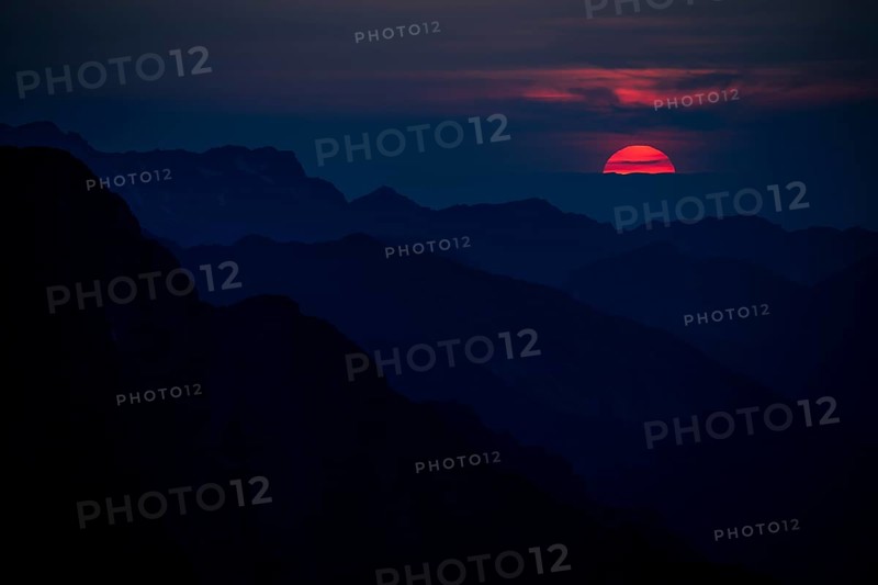 Fiery sunball at sunset with Lechtaler Alps