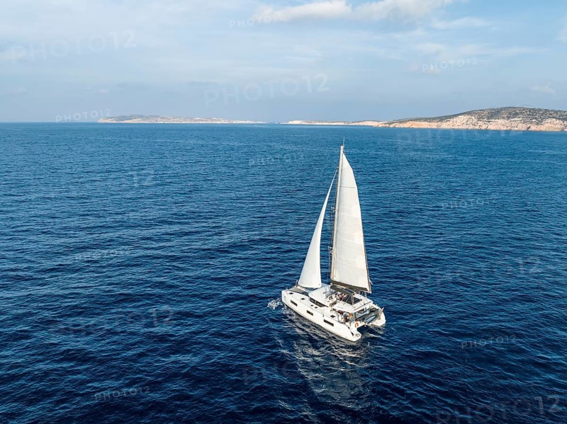 Sailing catamaran in full sail