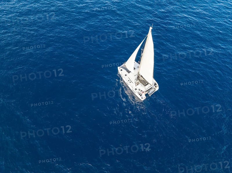 Sailing catamaran in full sail