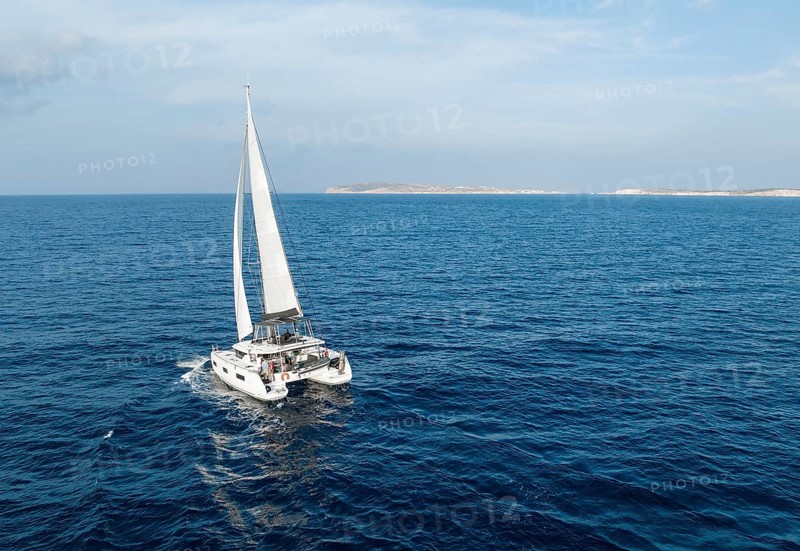 Sailing catamaran in full sail