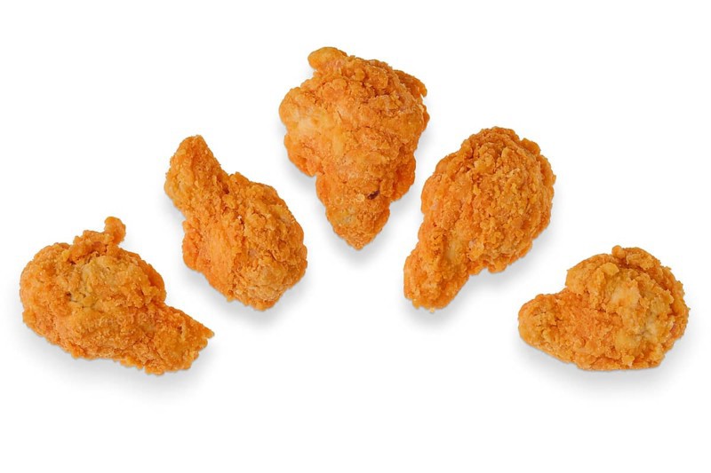 Top view of semifinished frozen chicken drumsticks ready for deep frying