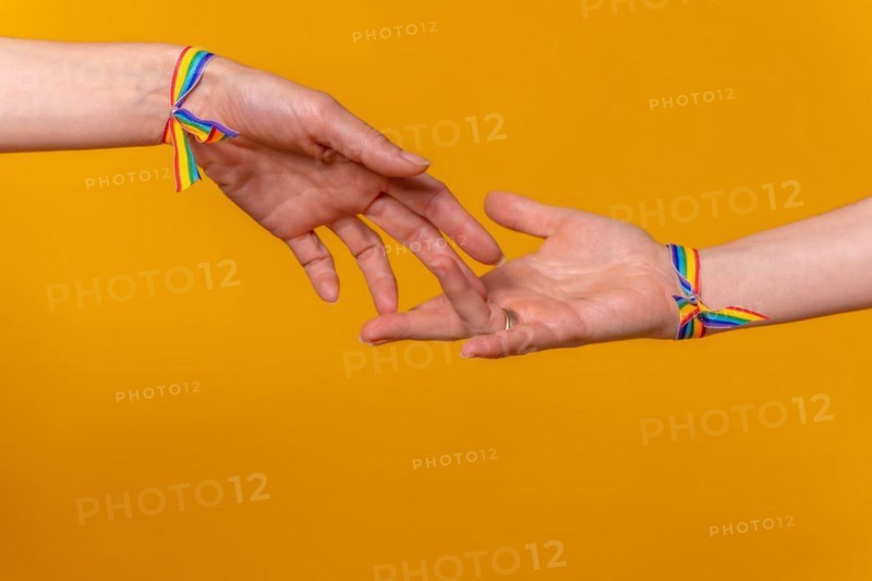 Hands of two women caressing and touching fingers