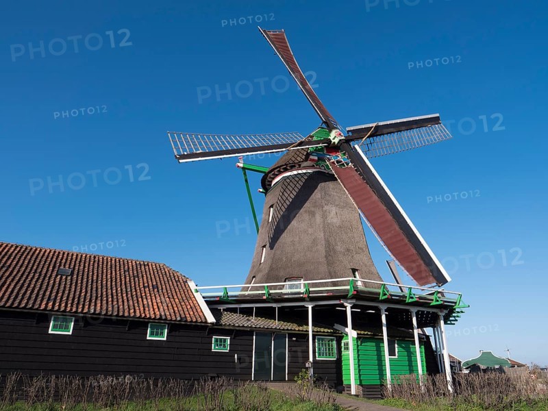 De Zoekern oil mill on the banks of the river Zaan in the Zaanse Schans museum village