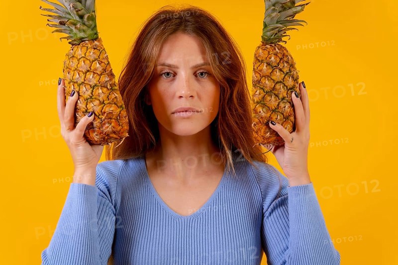 Woman with a pineapple in sunglasses