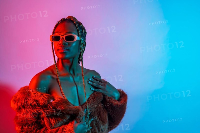 Black ethnic woman with braids with red and blue led lights
