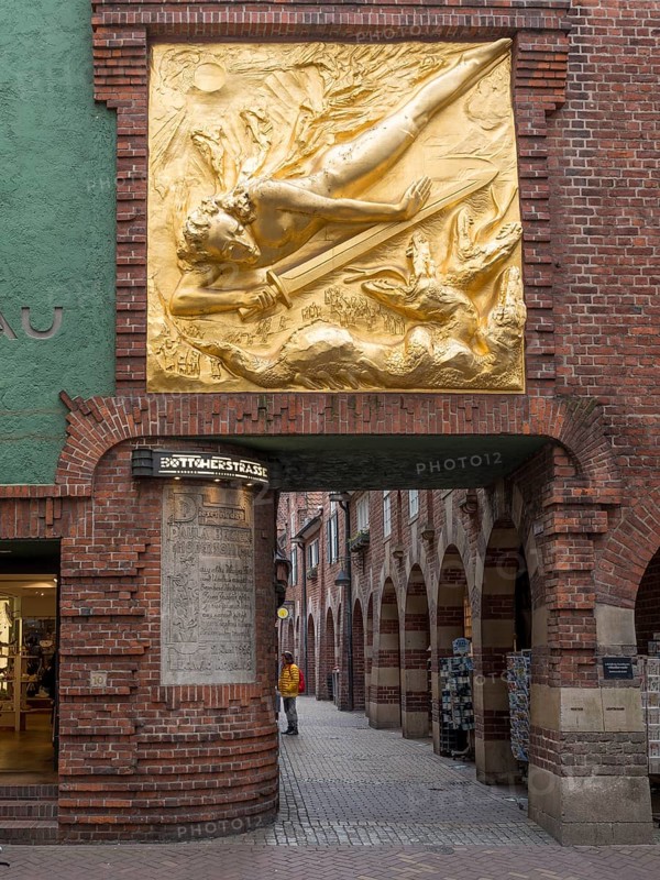 Entrance to Boettcherstrasse with gilded bronze relief by Bernhard Hoetger