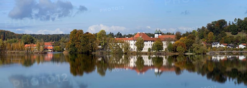 Panoramic view of Seeon Monastery with reflection in Kolstersee