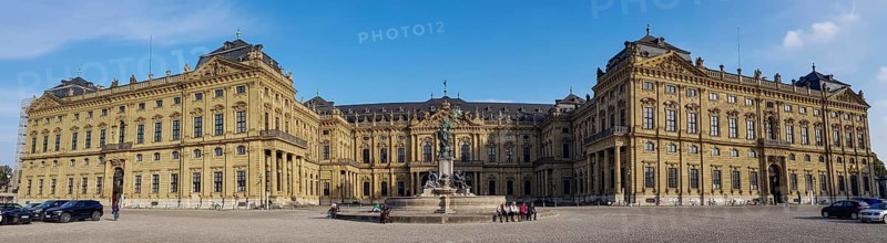 Panorama photo Frankoniabrunnen on the side of the Ehrenhof and Wuerzburg Palace Wuerzburg Residence and Court Garden
