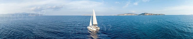 Sailing catamaran in full sail