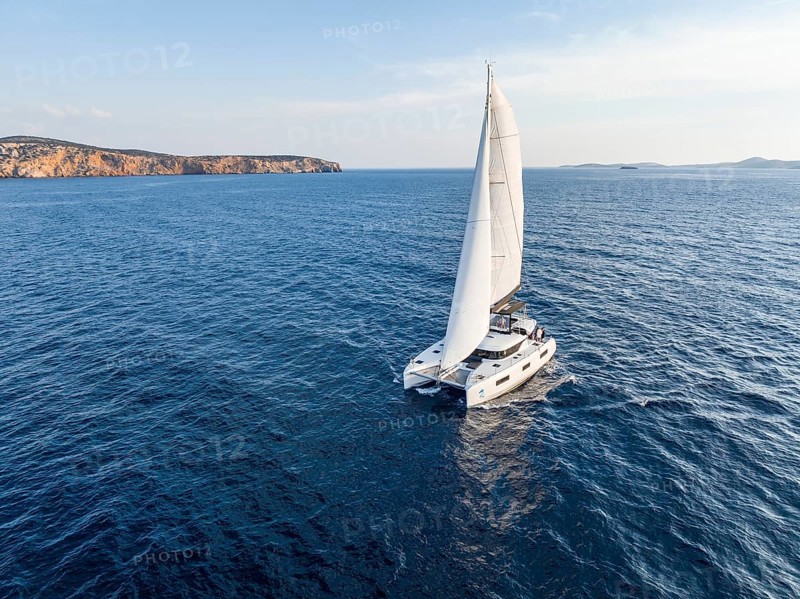 Sailing catamaran in full sail