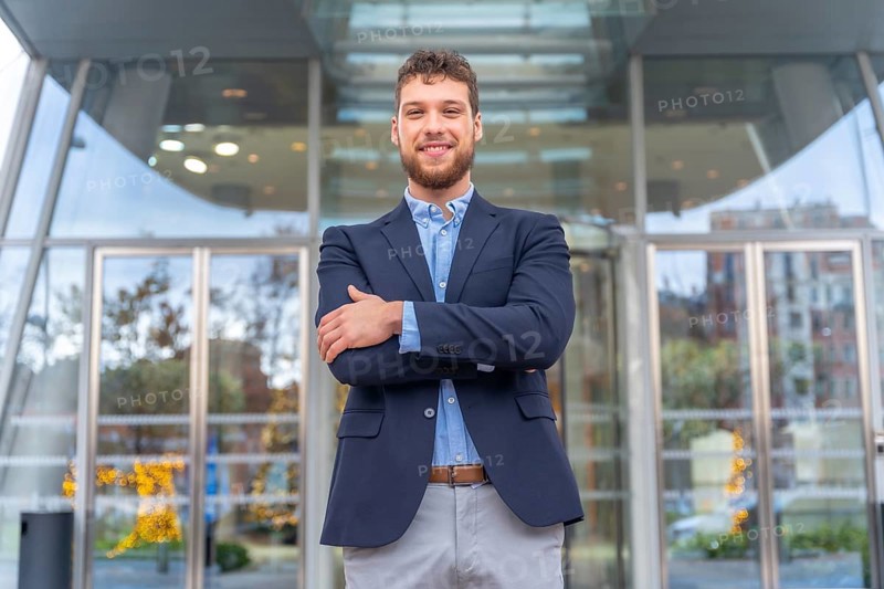 Portrait businessman CEO of a company at the entrance of the office