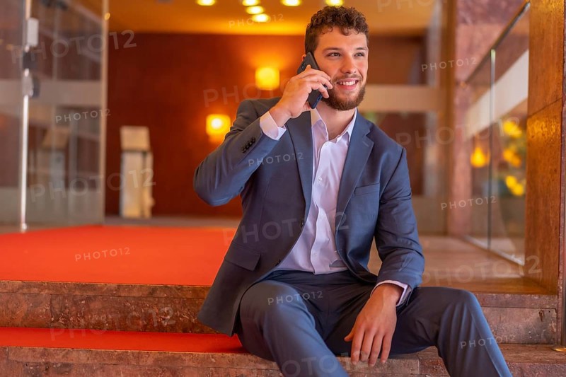 Portrait Male businessman or finance going down the stairs of the offices where he is the CEO of the company
