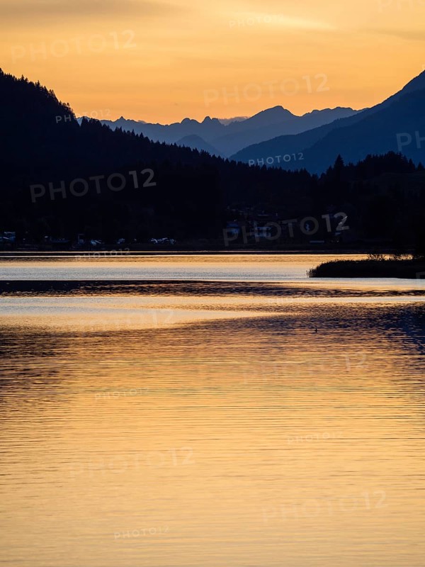 Evening atmosphere at sunset at Lake Weissensee