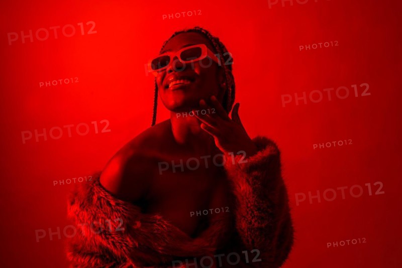Attractive black ethnic woman with braids with red led lights