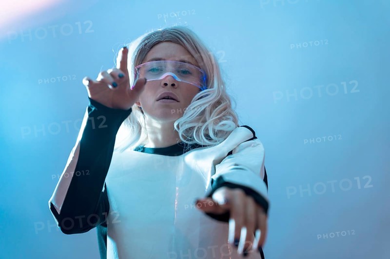 Woman watching with the illuminated futuristic glasses