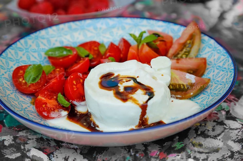 Tomatoes with basil and buffalo mozzarella