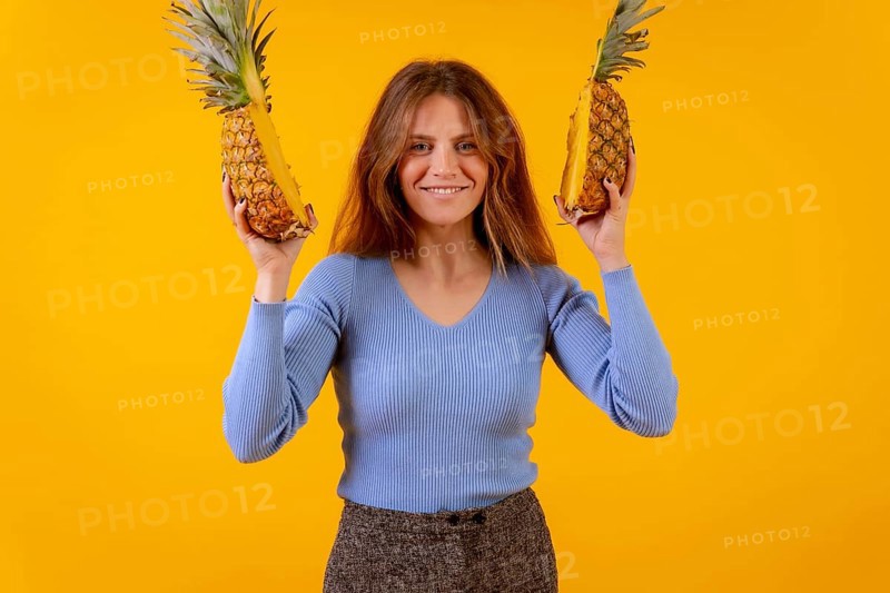Woman with a pineapple in sunglasses