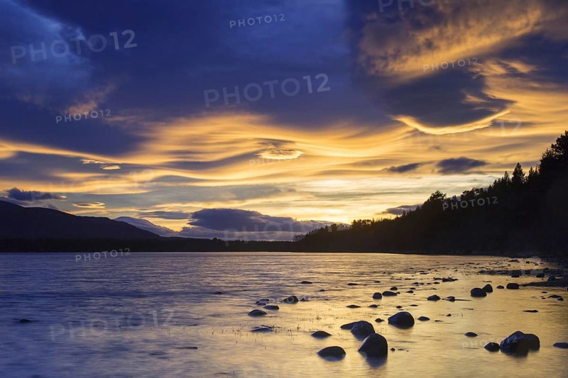 Loch Morlich and Cairngorm Mountains at sunset
