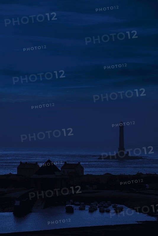 Lighthouse and lifeboat station in the Goury port near Auderville at the Cap de La Hague at night