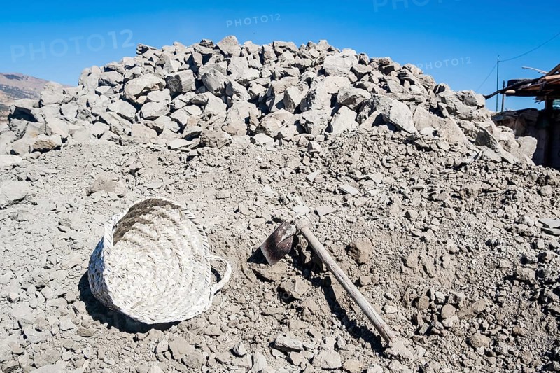 Heap of clay and equipment used in pottery factory in Fez