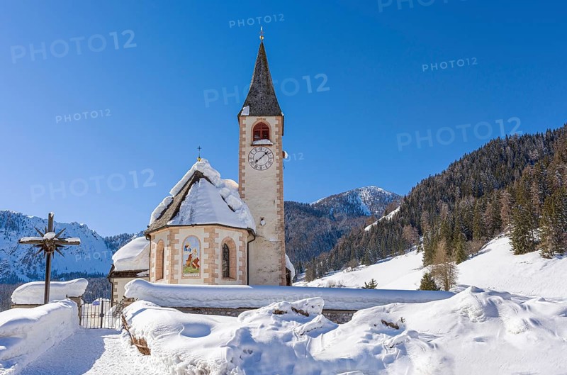 Snow-covered church in the Fanes Sennes Braies nature park Park