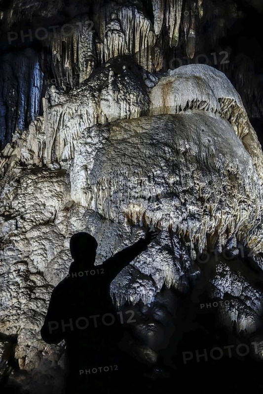 Guide in front of flowstone