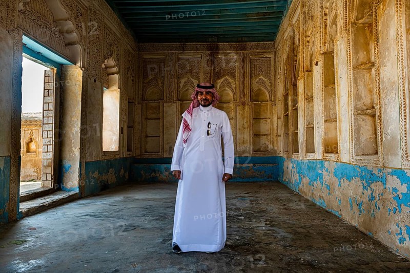 Man standing in a beautiful old merchant house