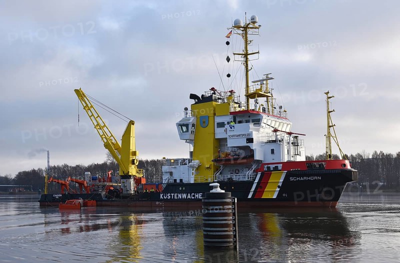 Coastguard vessel cleans water in Kiel Canal near Brunsbuettel