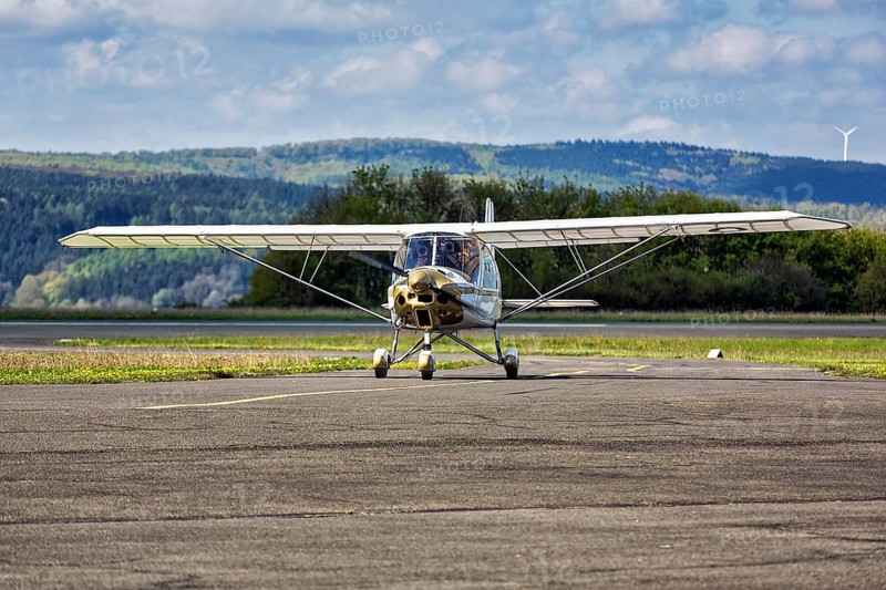 Light aircraft Comco Ikarus C42 Cyclone stands by at the airport