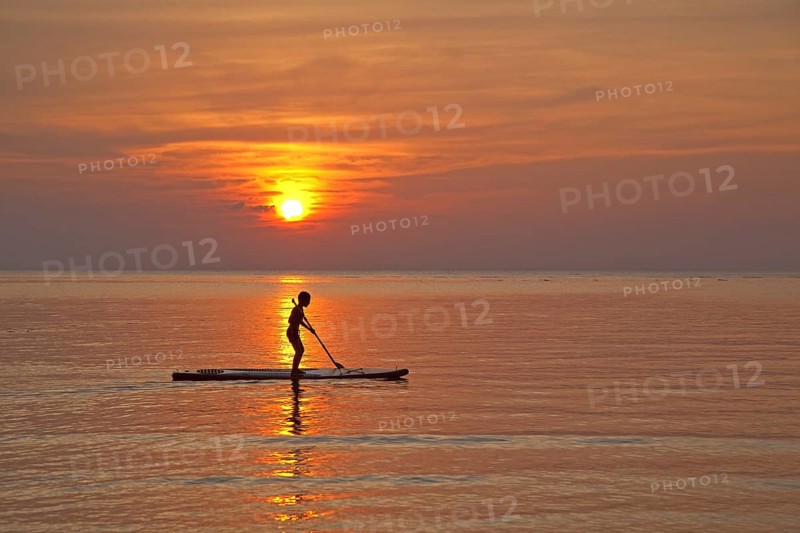 Child standup paddleboarding