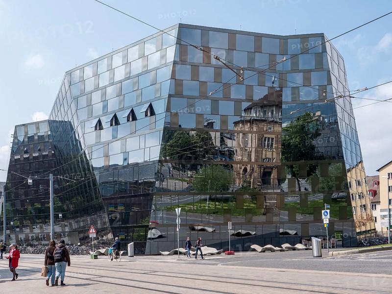 The building of the university library and the reflection on the glass facade of the building