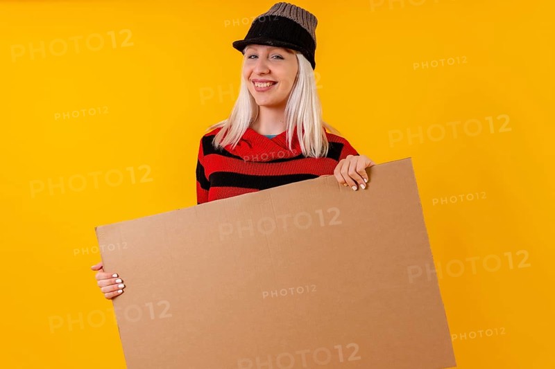 Holding empty cardboard advertisement poster