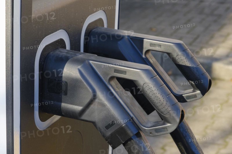Electric charging cable at a petrol pump for electric cars