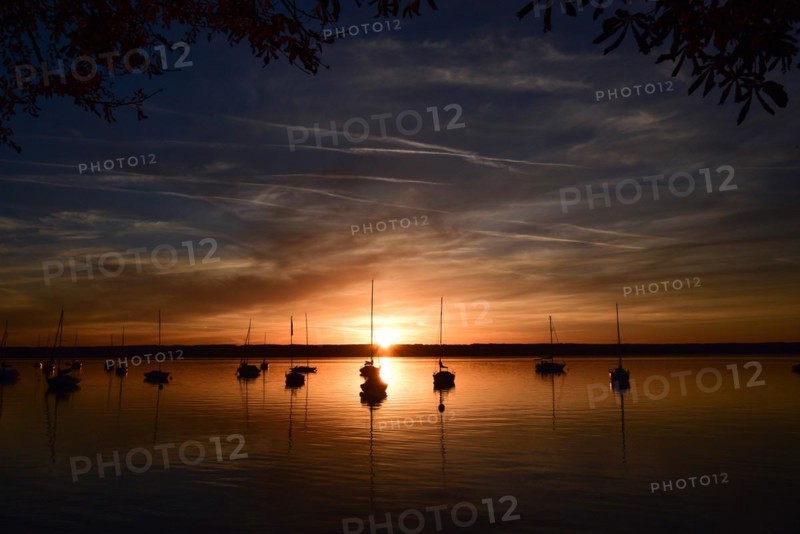 Sailing boats in the sunset in Herrschinger Bucht on Lake Lake Ammer