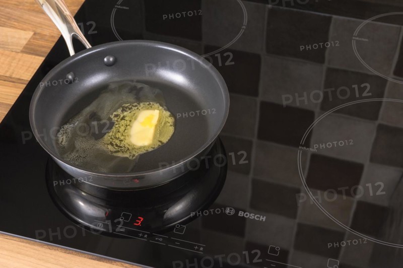 Butter melting in a frying pan
