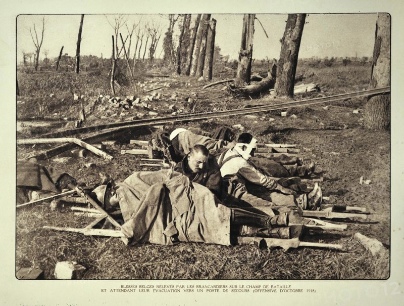 Wounded soldiers on stretchers waiting for evacuation from the battlefield in Flanders during the First World War