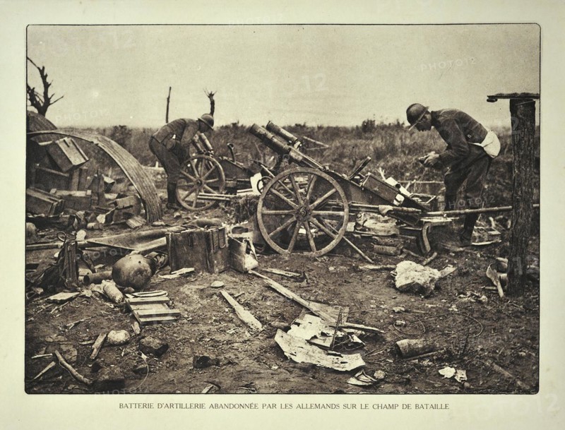 Soldiers and abandoned German artillery battery