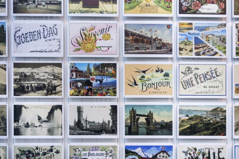 Collection of international vintage postcards of the early 20th century showing drawings and old photographs of holiday destinations
