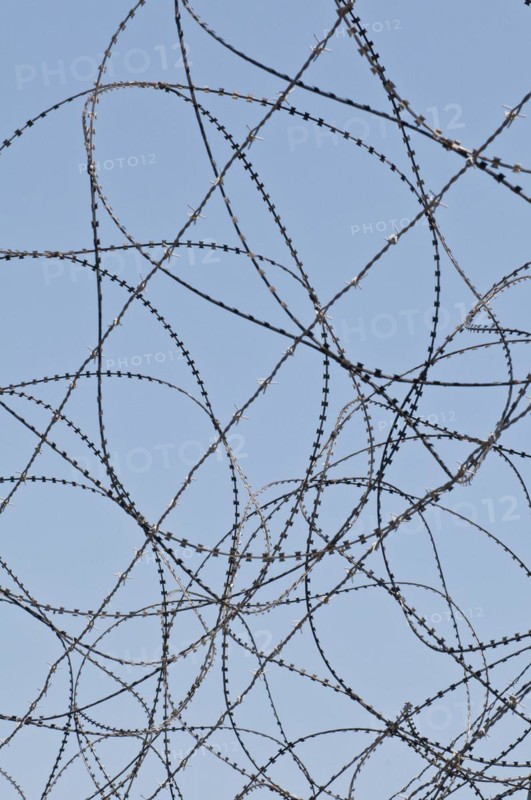 Razor wire on top of the DMZ