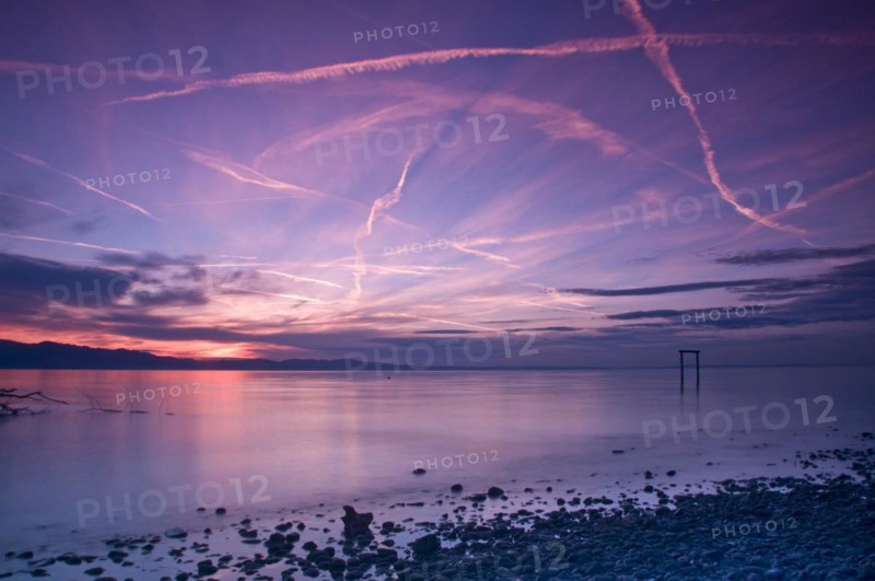 Sunset sky with condensation trails