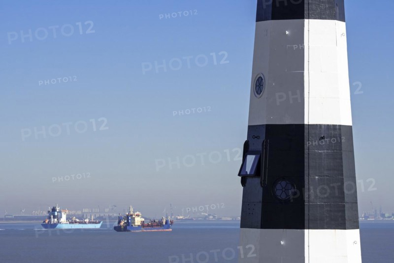Nieuwe Sluis lighthouse near Breskens and container ship