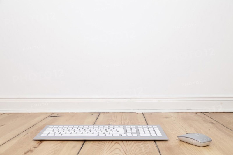 Keyboard and computer mouse on the floor