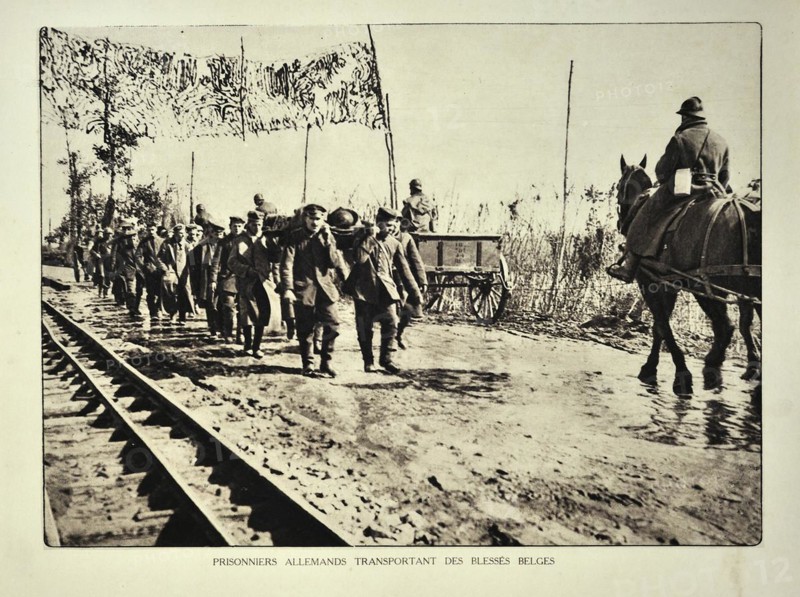 German prisoners evacuating wounded Belgian soldiers on stretchers in Flanders during the First World War