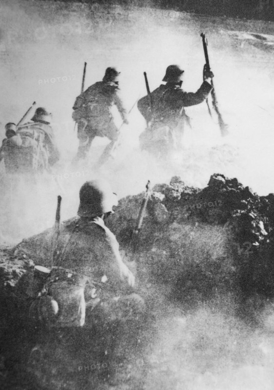 German WWI stormtroopers advance through clouds of smoke towards enemy positions on the Western Front during the Spring Offensive of 1918