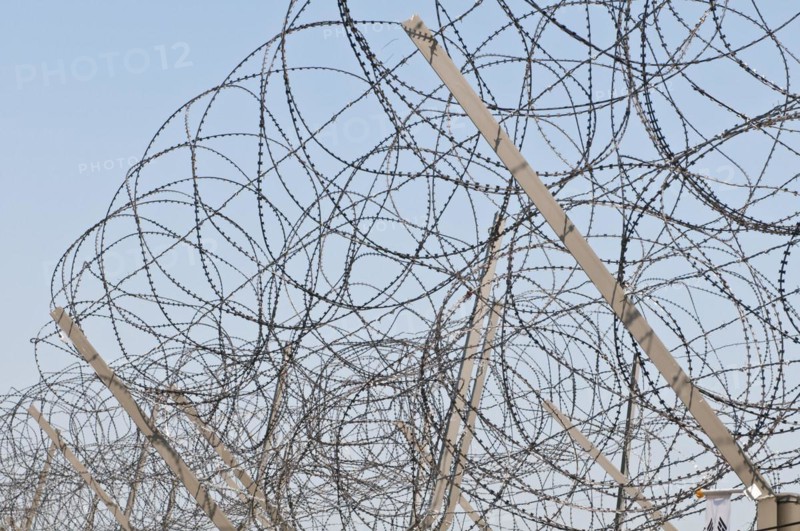 Razor wire on top of the DMZ